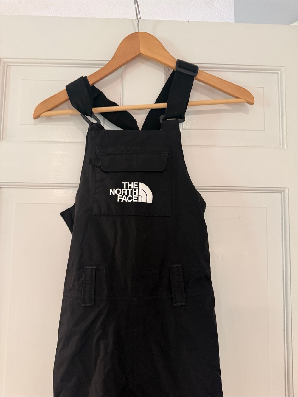 The North Face Black Kids Snow Overalls with White Logo.